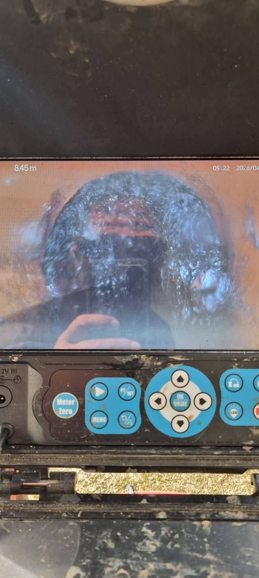 CCTV monitor showing root intrusion inside a drain at depth